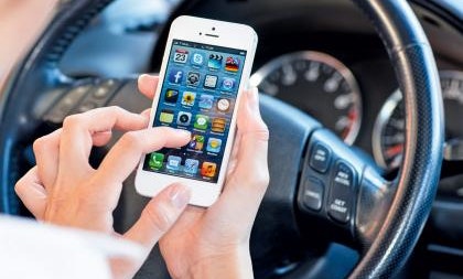 Over half of motorists use mobile phones behind the wheel, research shows.