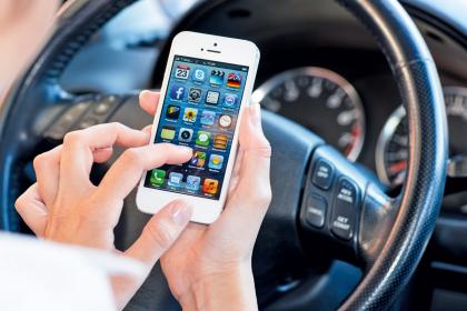 Over half of motorists use mobile phones behind the wheel, research shows.